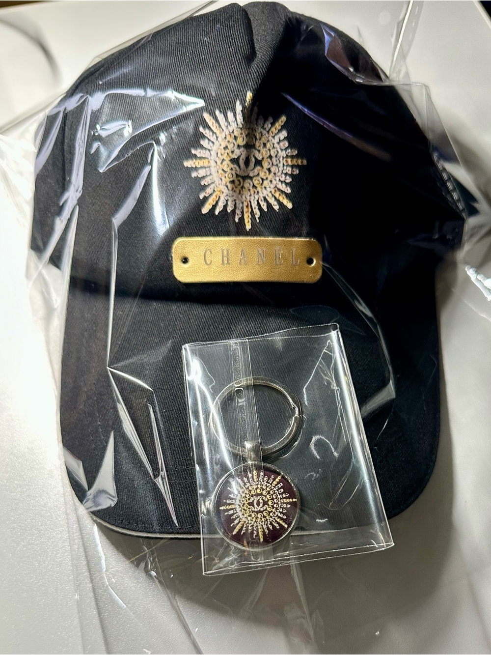 CHANEL Novelty Gift Set: Black Baseball Cap Gold Sunburst Emblem w/ Key Chain - Picture 9 of 16